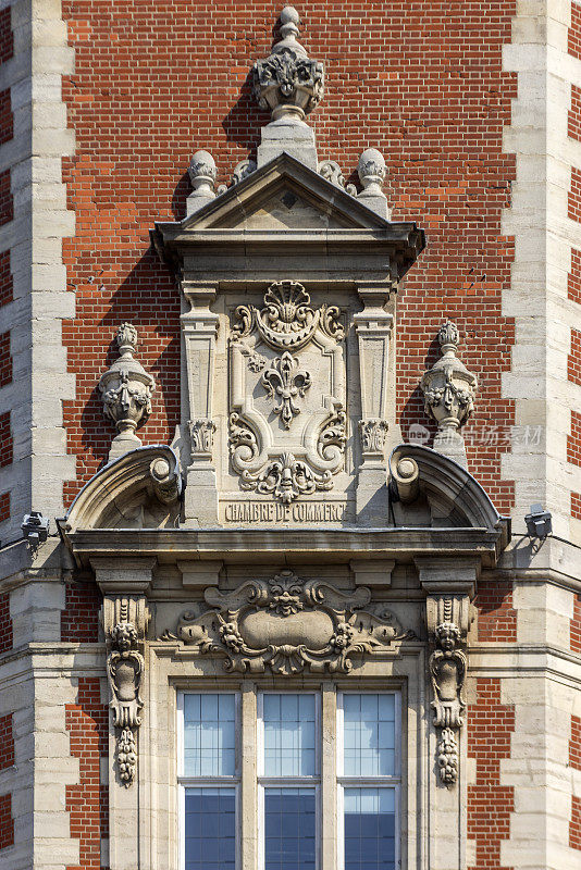 detail of the tower of the Chamber of Commerce in the French city of Lille on the Place du Théâtre. The building was built between 1910 and 1921 and was designed by architect Louis Marie Cordonnier